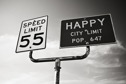Psychology Tools for Happiness - Image of road sign Happy City Limit