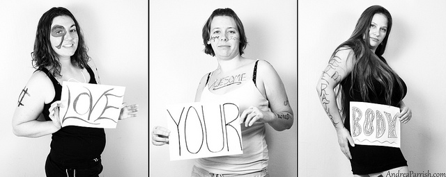 3 women with signs saying "love your body" - how to combat negative body image