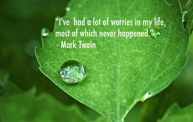 Peaceful nature image with quote from mark twain - I've had a lot of worries in my life, most of which never happened."