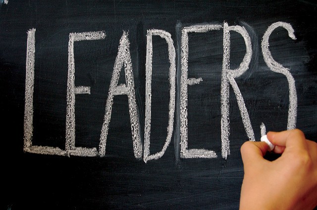 The word 'Leaders' written on chalkboard. For example, female thought leaders in the field of psychology.