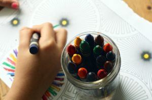 crayons coloring book. expressive art therapy can promote children's mental health.
