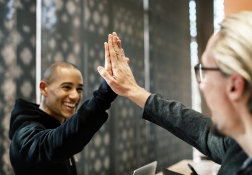 young person being congratulated with a high five