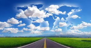 graphic of open road with clouds in the sky that upon closer look, form all continents of the world, demonstrating importance of paying attention