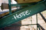 The word hope painted on a metal and wood structure that looks like a bleacher