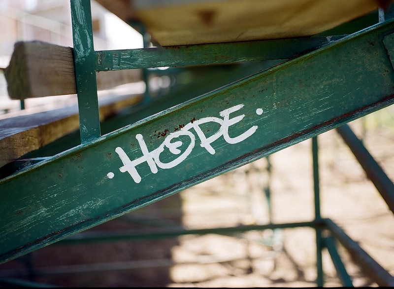 The word hope painted on a metal and wood structure that looks like a bleacher