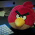 Angry Bird stuffed animal sitting next to keyboard for blog post: What is Anger? A Secondary Emotion